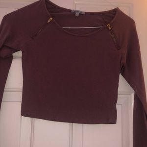 Cropped pink long sleeve shirt.